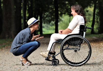 Woman on black folding wheelchair 2026764 scaled